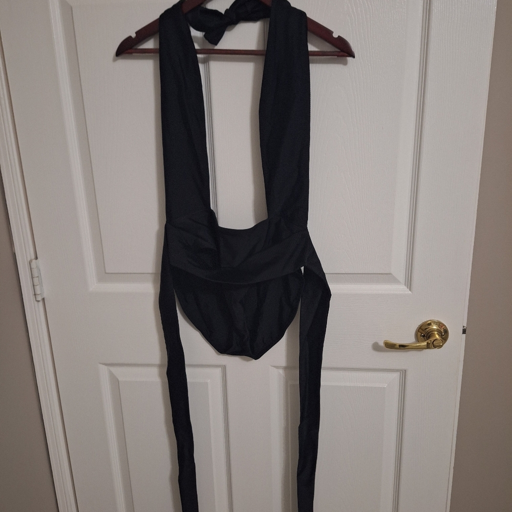 Sexy Black Beach Bunny One-piece ties around the waist.
